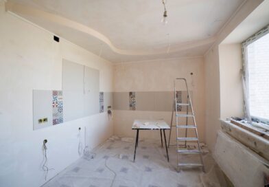 Spacious kitchen under renovation with a ladder and tools